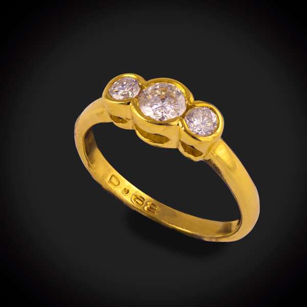 18ct yellow gold three stone diamond ring.