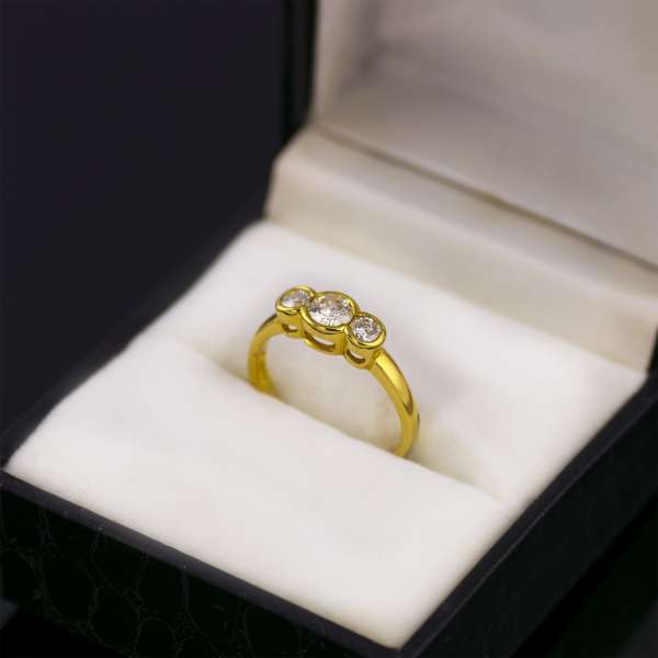 18ct yellow gold three stone diamond ring and box.