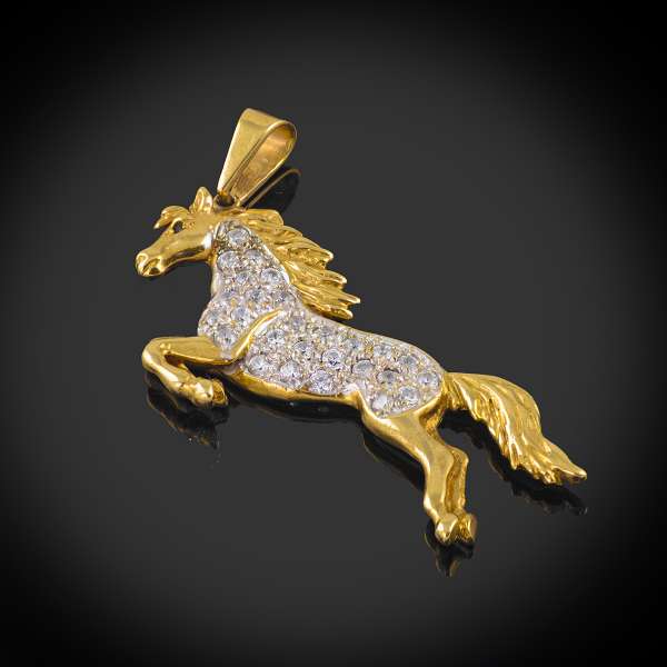 9ct gold stone set horse pendant.