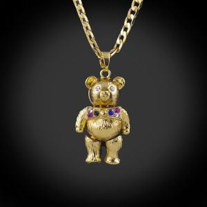 18ct gold bonded teddy bear pendant and 24 inch curb chain.